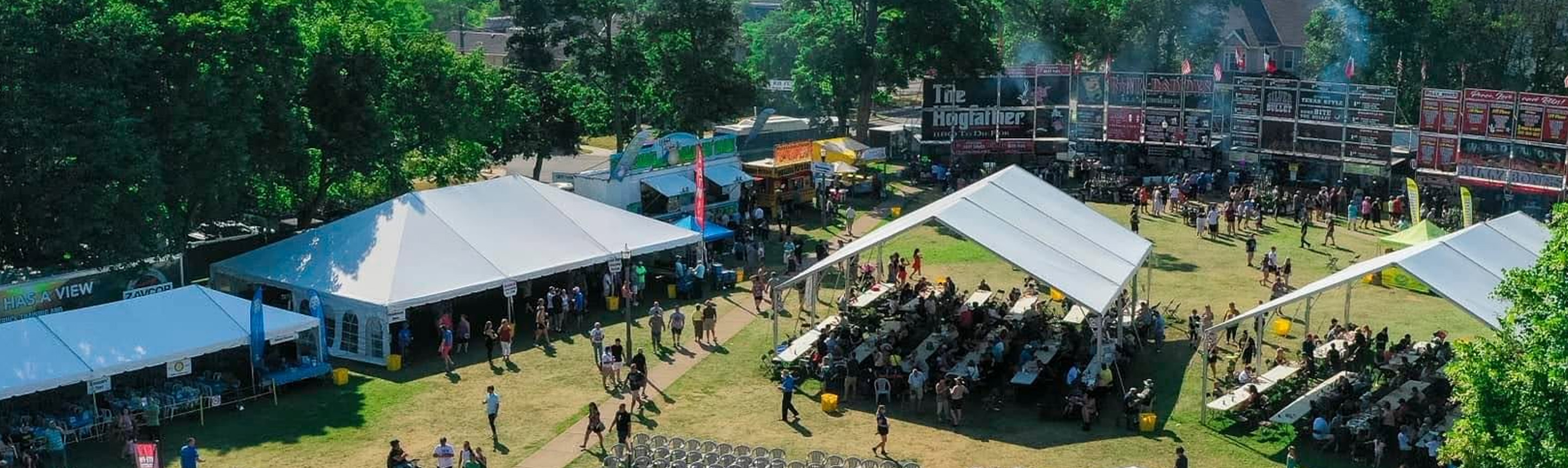Image looking down on St. Catharines Rotary Ribfest outdoor event with shade tents and rib vendors